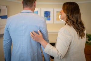 A man and a woman with their backs to the camera